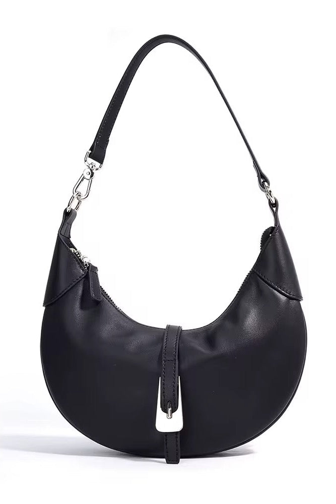 Black handbag with a unique design on a white background
