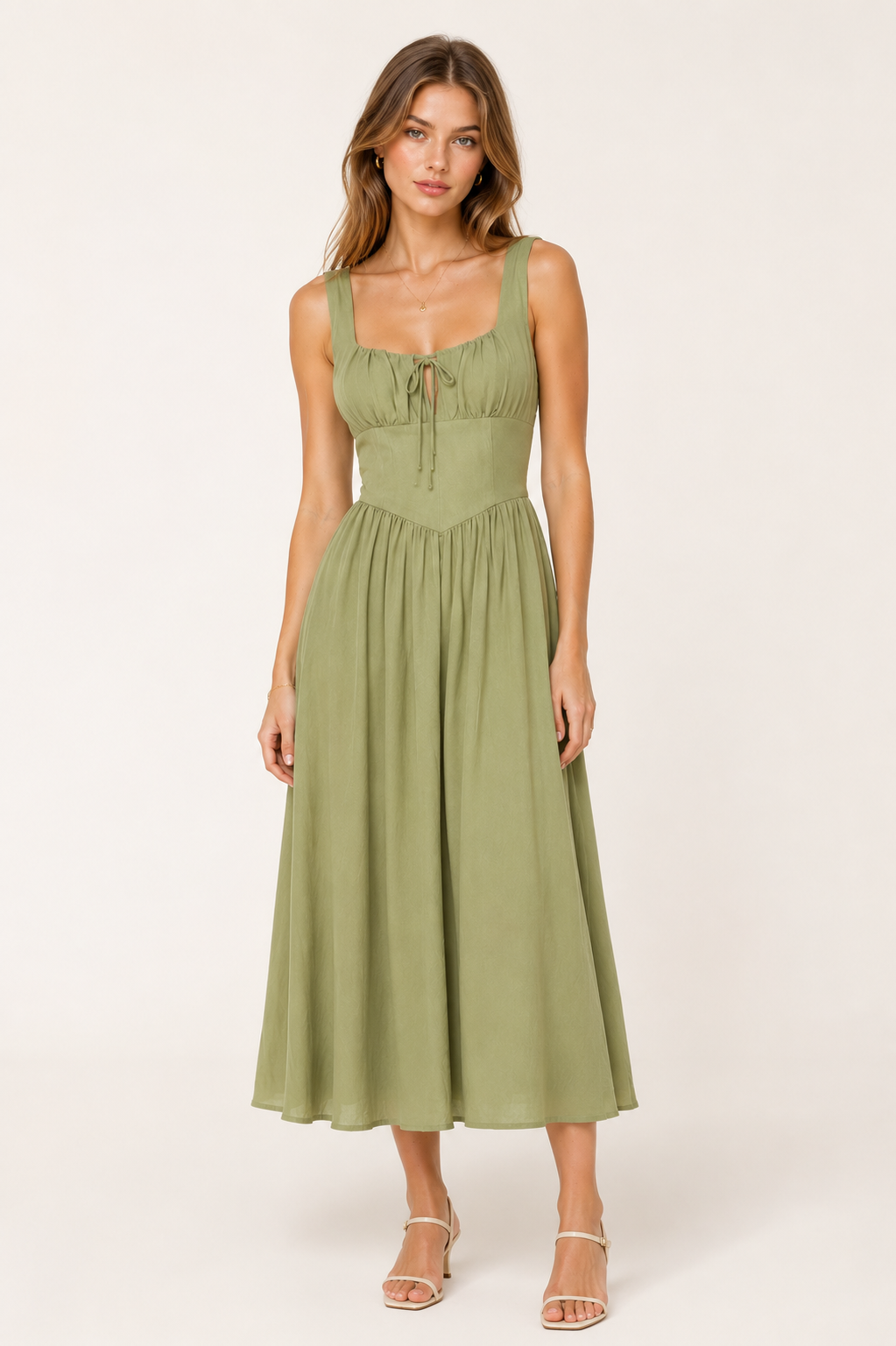 Woman wearing a green dress on a white background