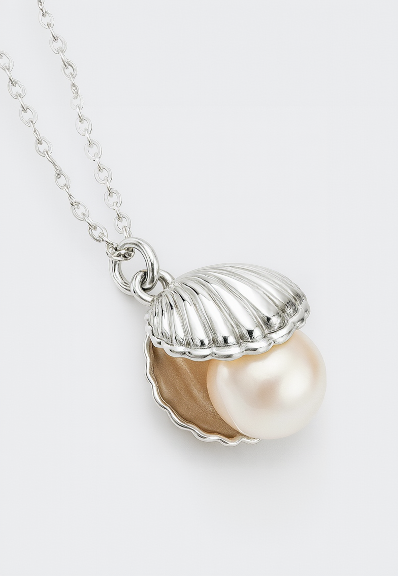 Silver shell pendant with a pearl on a white background