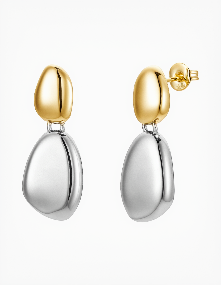 Gold and silver earrings on a white background