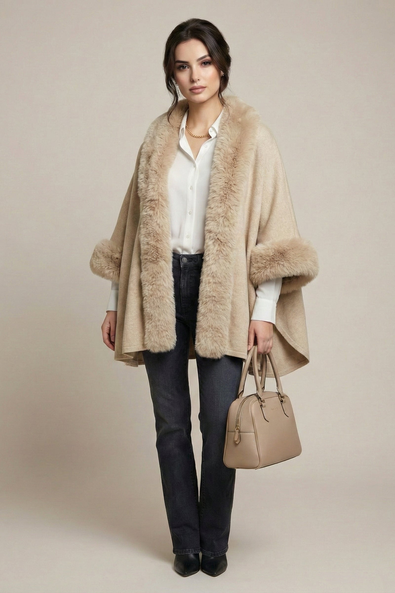 Woman wearing a beige fur-trimmed coat with a plain background