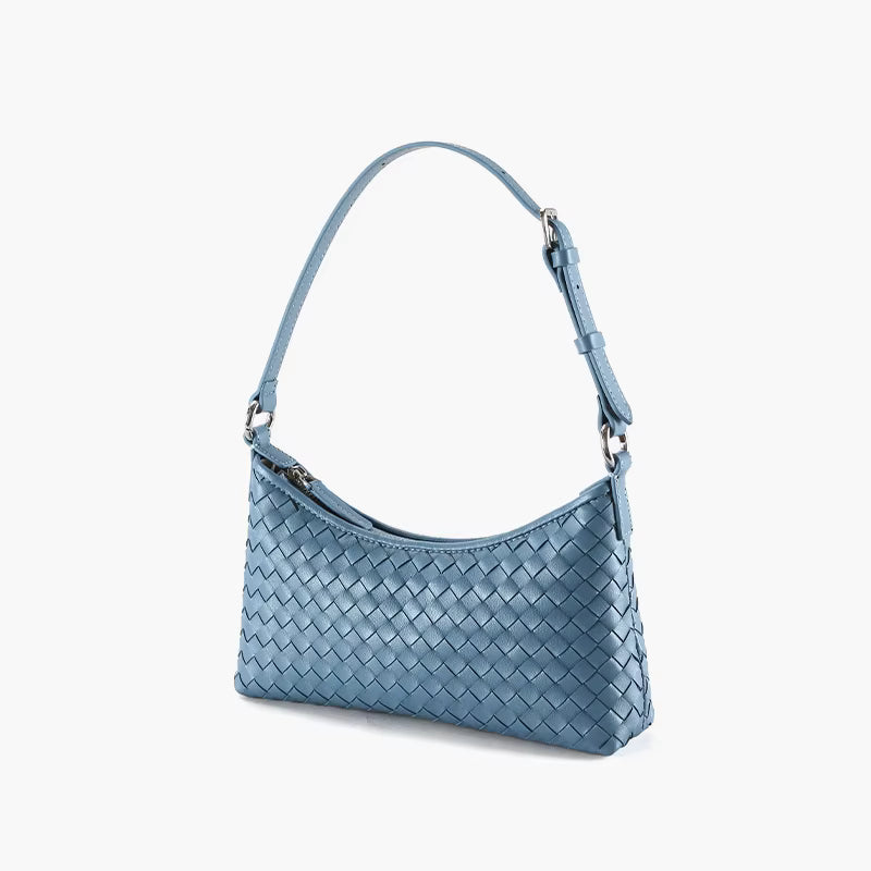 Blue woven handbag on a white background