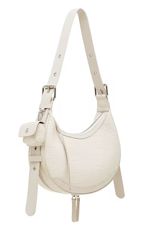 White handbag with a strap on a white background