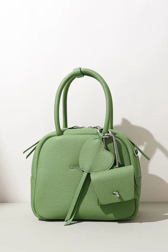 Green handbag on a light background