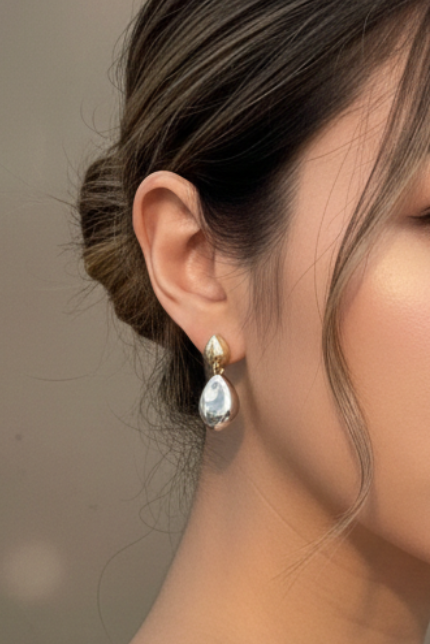 Woman wearing a white off-shoulder top against a neutral background