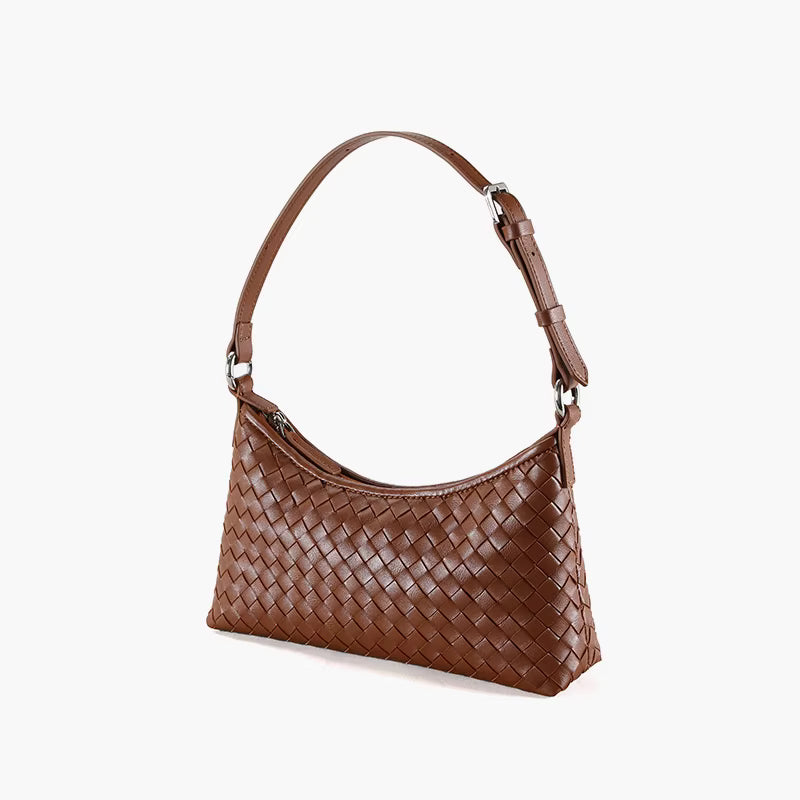 Brown woven handbag on a white background