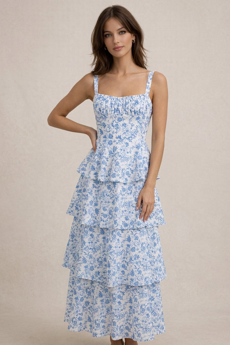 Woman wearing a blue floral dress on a beige background