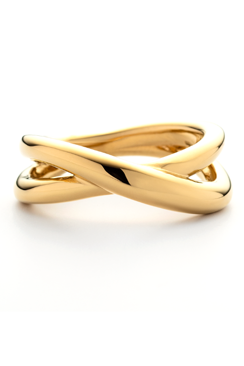 Gold ring with a twisted design on a white background