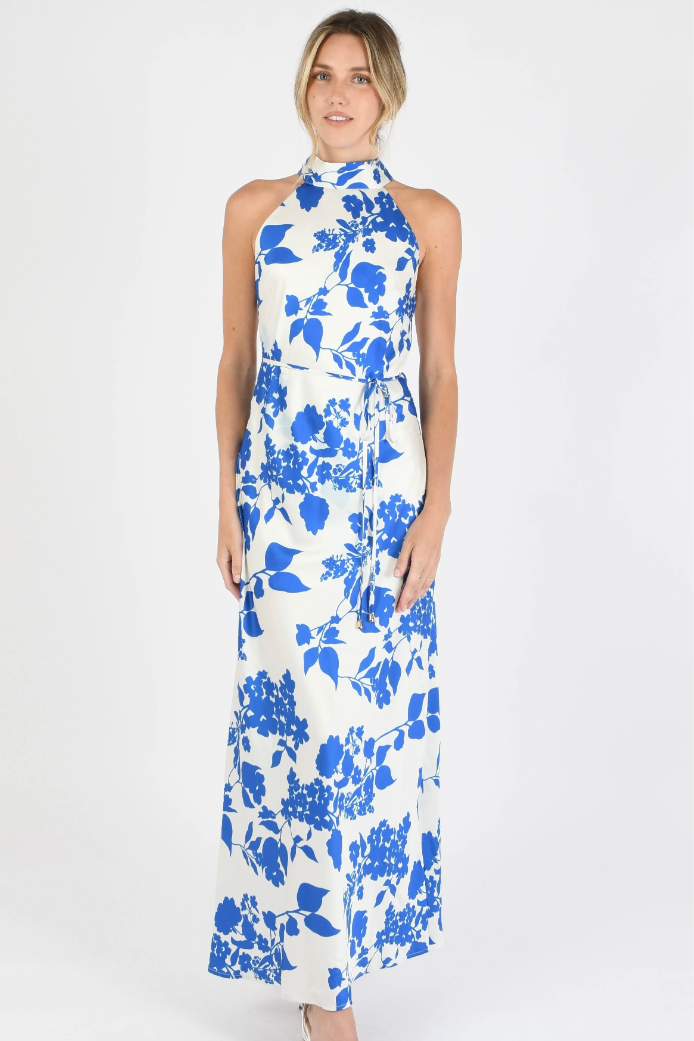 Woman wearing a blue floral dress on a white background
